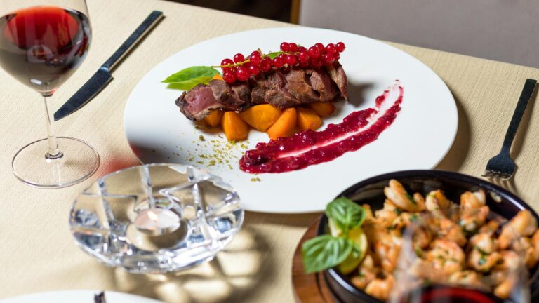 Delicious gourmet steak dinner with wine, served elegantly for fine dining.